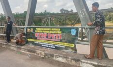 Usai Pemberitaan Viral, Baliho Larangan PETI Terpasang di Jembatan Desa Jelatang